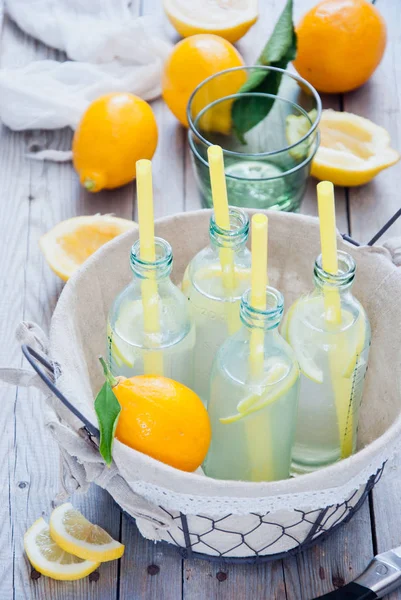 Basket lemonade bottles — Stock Photo, Image