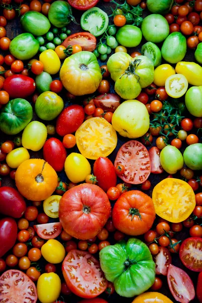 Fresh organic red, green and yellow tomatoes Stock Picture