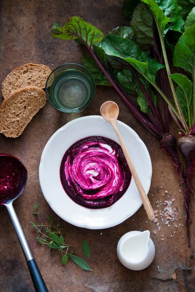 Creamy Beetroot soup on brown wooden background Stock Image