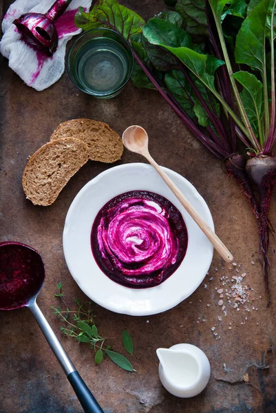 Creamy Beetroot soup on brown wooden background Stock Image