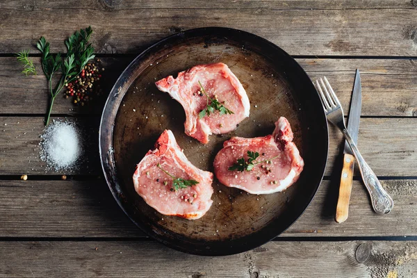 Raw meat on the vintage table — Stock Photo, Image