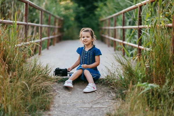 Little girl with camera — Stock Photo, Image