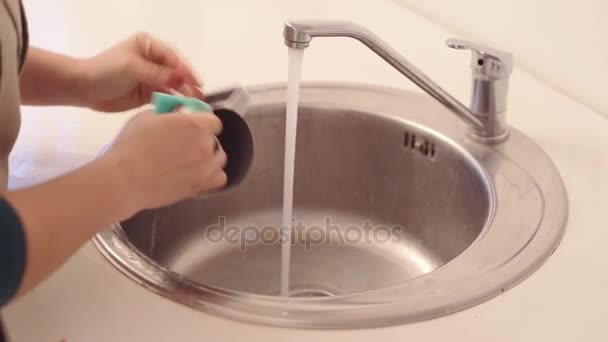 Close up of womans hands washing the metal tableware — Stock Video