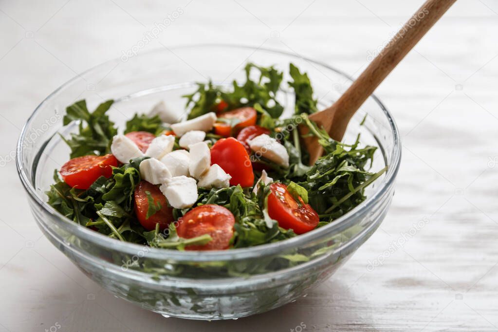 Caprese salad. Healthy meal with cherry tomatoes, mozzarella