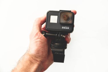 Minsk, Belarus - December 20, 2019: GoPro HERO 7 Black action camera with hand strap on white background