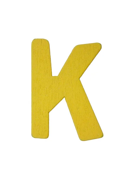 Желтая деревянная буква K — стоковое фото