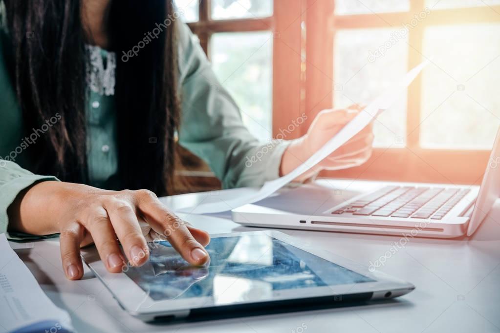 Businesswoman working with digital tablet 