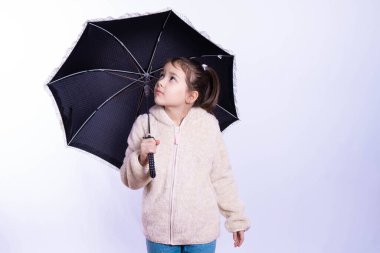 little girl with a black umbrella 
