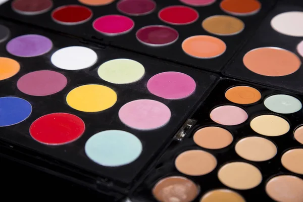 colorful eyeshadow palette and blush for make-up closeup