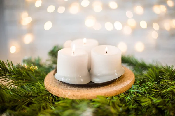 Christmas candles on a fir branch — Stock Photo, Image