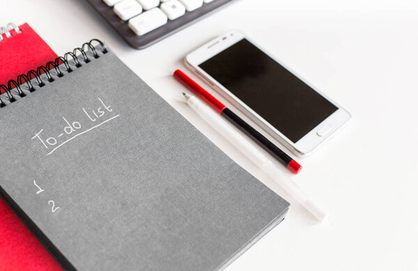 to-do list in a notebook on the office desk