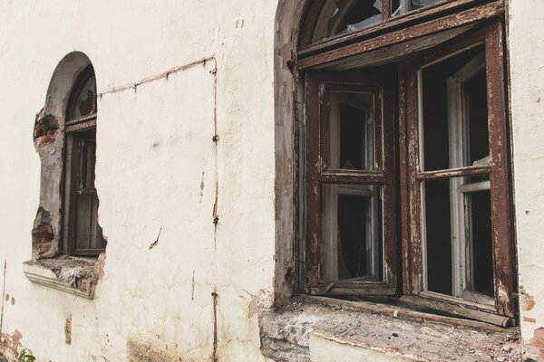 exterior of a destroyed building. Abandoned atmosphere