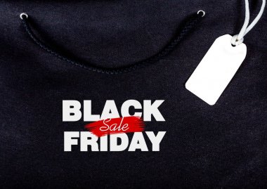 yazıt siyah Cuma günü bir dize ile siyah bir çanta arka plan etiketi