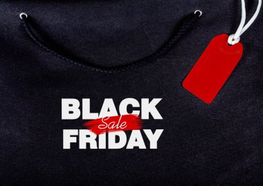 yazıt siyah Cuma günü bir dize ile siyah bir çanta arka plan etiketi