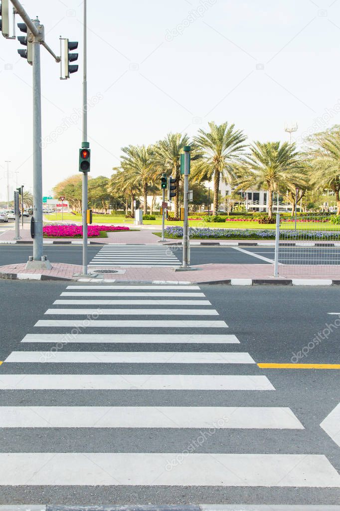Empty pedestrian crossing at an adjustable intersection.