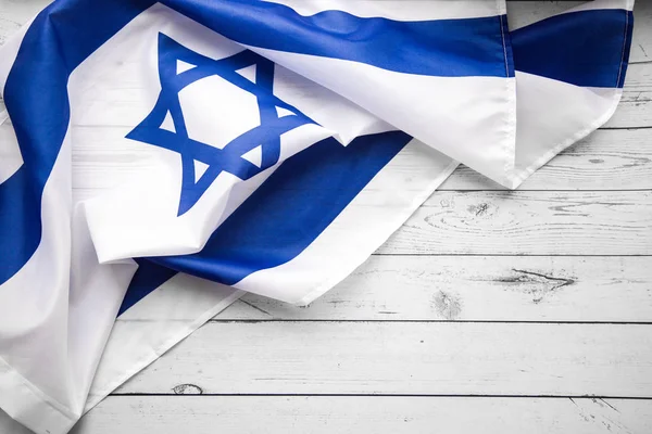 Un colpo ravvicinato di bandiera israeliana bianca e blu sventolata. Felice giorno dell'indipendenza Israele, vista dall'alto, laico piatto — Foto Stock