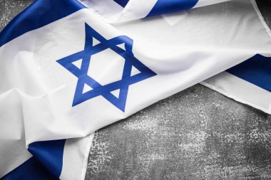 Close up shot of wavy blue and white Israeli flag. Happy independence day Israel, top view, flat lay