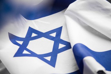 Close up shot of wavy blue and white Israeli flag. Happy independence day Israel, top view, flat lay