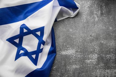 Close up shot of wavy blue and white Israeli flag. Happy independence day Israel, top view, flat lay
