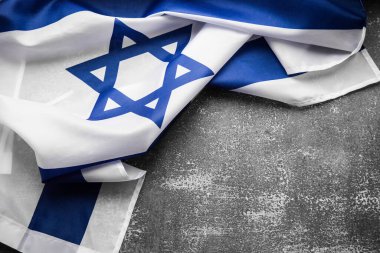 Close up shot of wavy blue and white Israeli flag. Happy independence day Israel, top view, flat lay