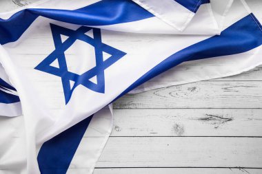 Close up shot of wavy blue and white Israeli flag. Happy independence day Israel, top view, flat lay