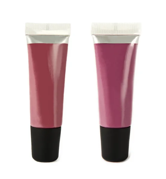 Pink and red lip gloss tubes — Stock Photo, Image