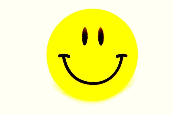 Yellow smile keychain magnet — Stock Photo, Image
