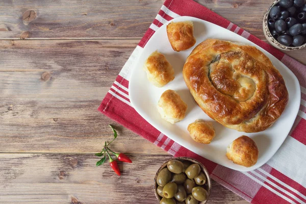 Balkan cuisine. Burek is family of baked filled pastries. Burek with cheese,  popular national dish.  Flat lay. Free space for text — Stock Photo, Image