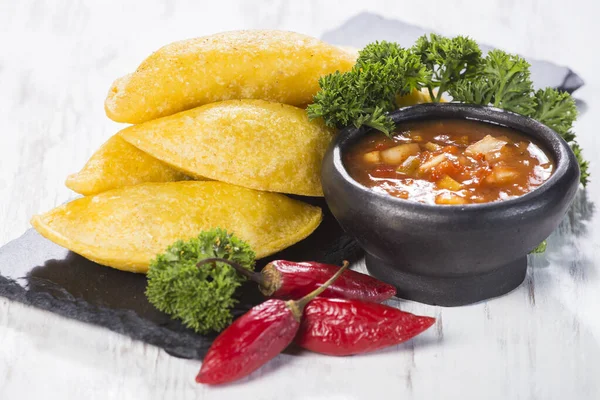 Empanadas with hot sauce, traditional Colombian food