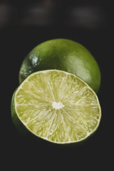 Lemon slice on black background, close-up image