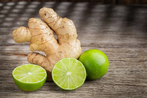 Ginger root and lemon on the table, space for text