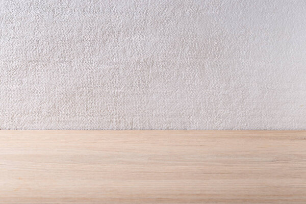 wooden board with white plaster background, rough textured background