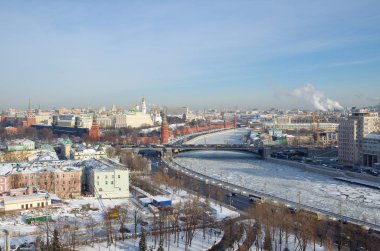 The Winter view of the Moscow Kremlin and the Moscow-river from the observation platform of Cathedral of Christ the Saviour, Moscow, Russia clipart