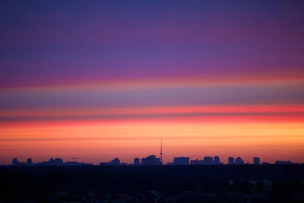 City silhouette against the sky on a sunrise.