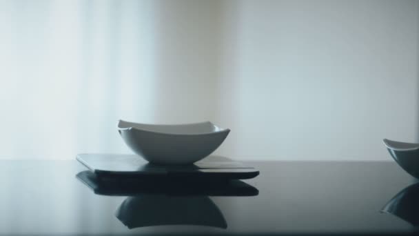 Baker pours brown sugar into bowl standing on scales in kitchen. — Stock Video