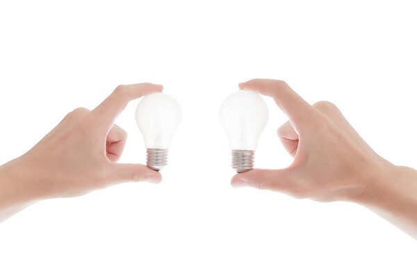 Lightbulb in a hand isolated on white background