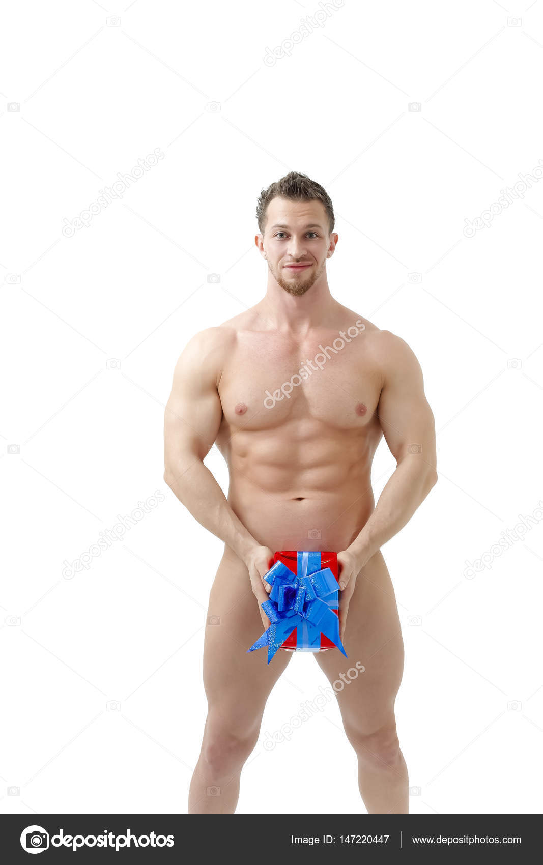 Naked Man With Sexy Ripped Sporty Body Holding A Present Copyspace On The Naked Man With Sexy Ripped Sporty Body Holding A Present Copyspace On The