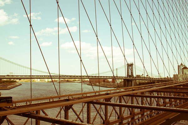 Manhattan bridge from Brooklyn bridge view in old vintage style, New York