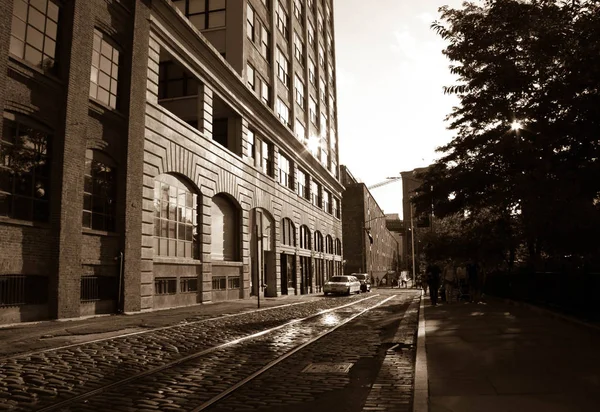 Buildings and the old road under the shade in vintage sepia style, New York — Stock Photo, Image