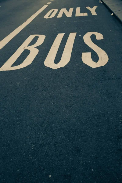 stock image Only bus traffic sign on the road in green dark vintage style