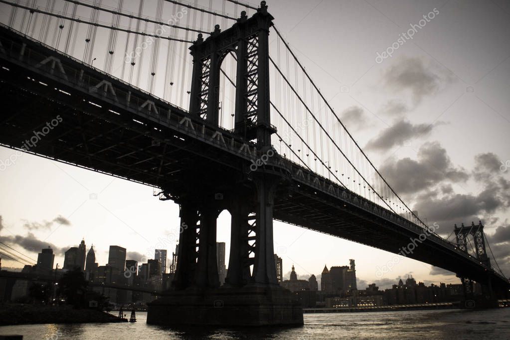 Silhouette of Manhattan bridge and city in old vintage style, New York