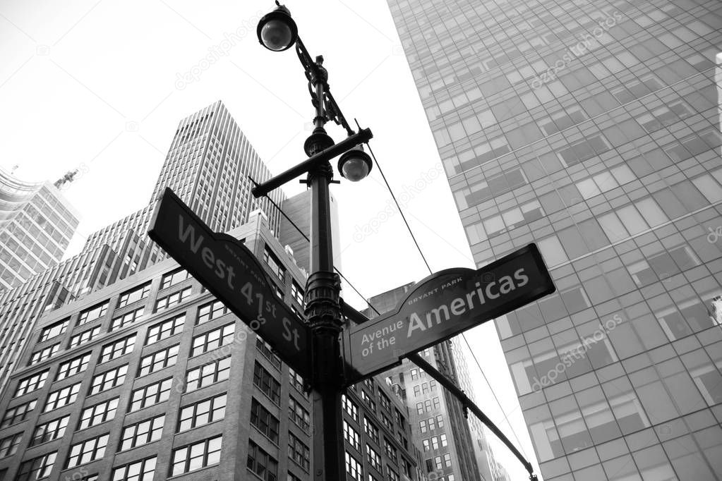 West 41st Street and Avenue of the American signs with buildings in black and white style, New York