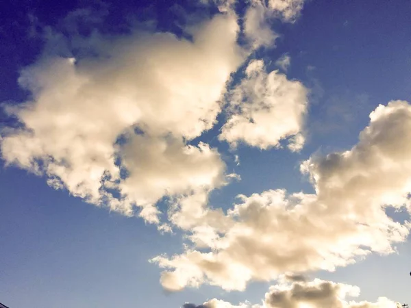 Shading cloudy bright blue sky in vintage style — Stock Photo, Image