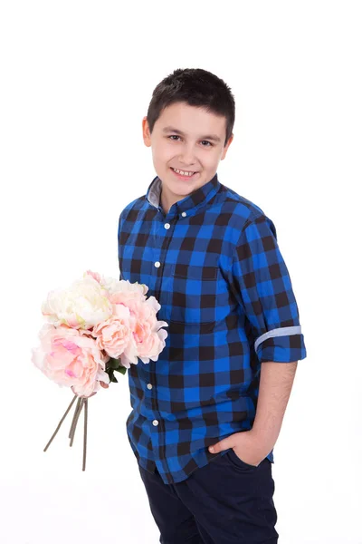 Portrait of a sweet young boy holding flowers, with white backgr — Stock Photo, Image