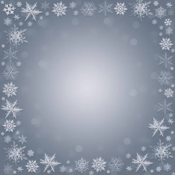 Snowflakes and fallen defocused snowflakes on blue christmas background — Stock Photo, Image