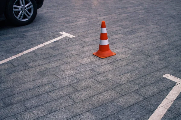 Closed car parking lot and traffic cone on street — Stock Photo, Image