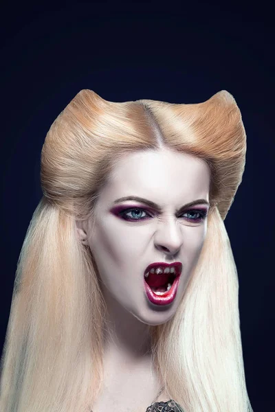 Beautiful blonde girl vampire with  blood is on the mouth and eyes — Stock Photo, Image