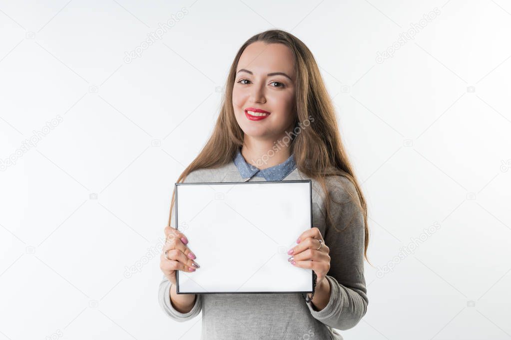 Young woman with an empty plate or frame