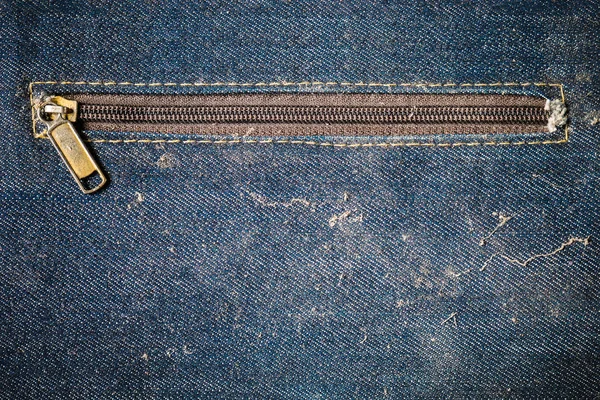 Old blue jeans bag dirty and more dust with stain unzipped. — Stock Photo, Image