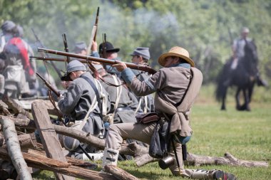 American Civil War reenactors  in action at the Dog Island event in Red Bluff, California.  April 29, 2018 clipart